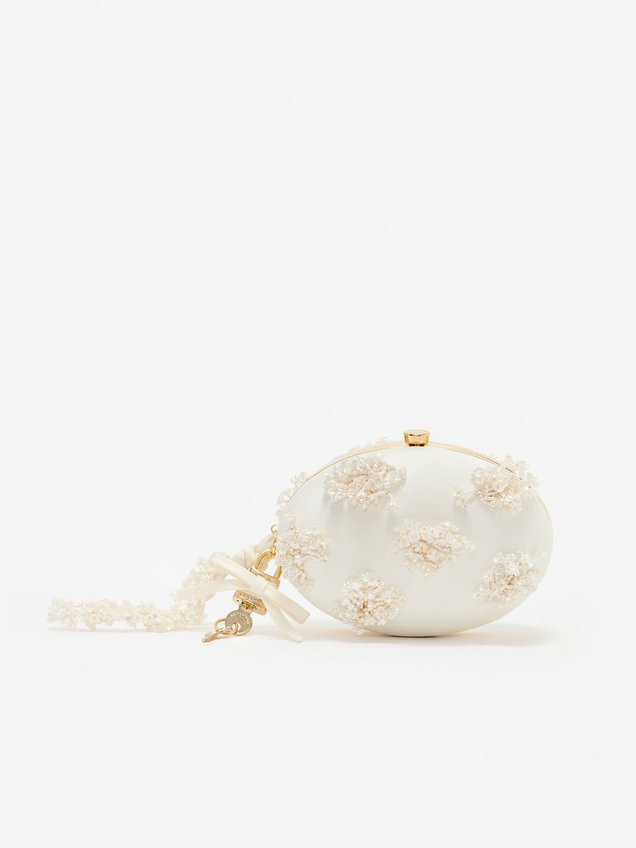 Cream satin floral beaded oval clutch