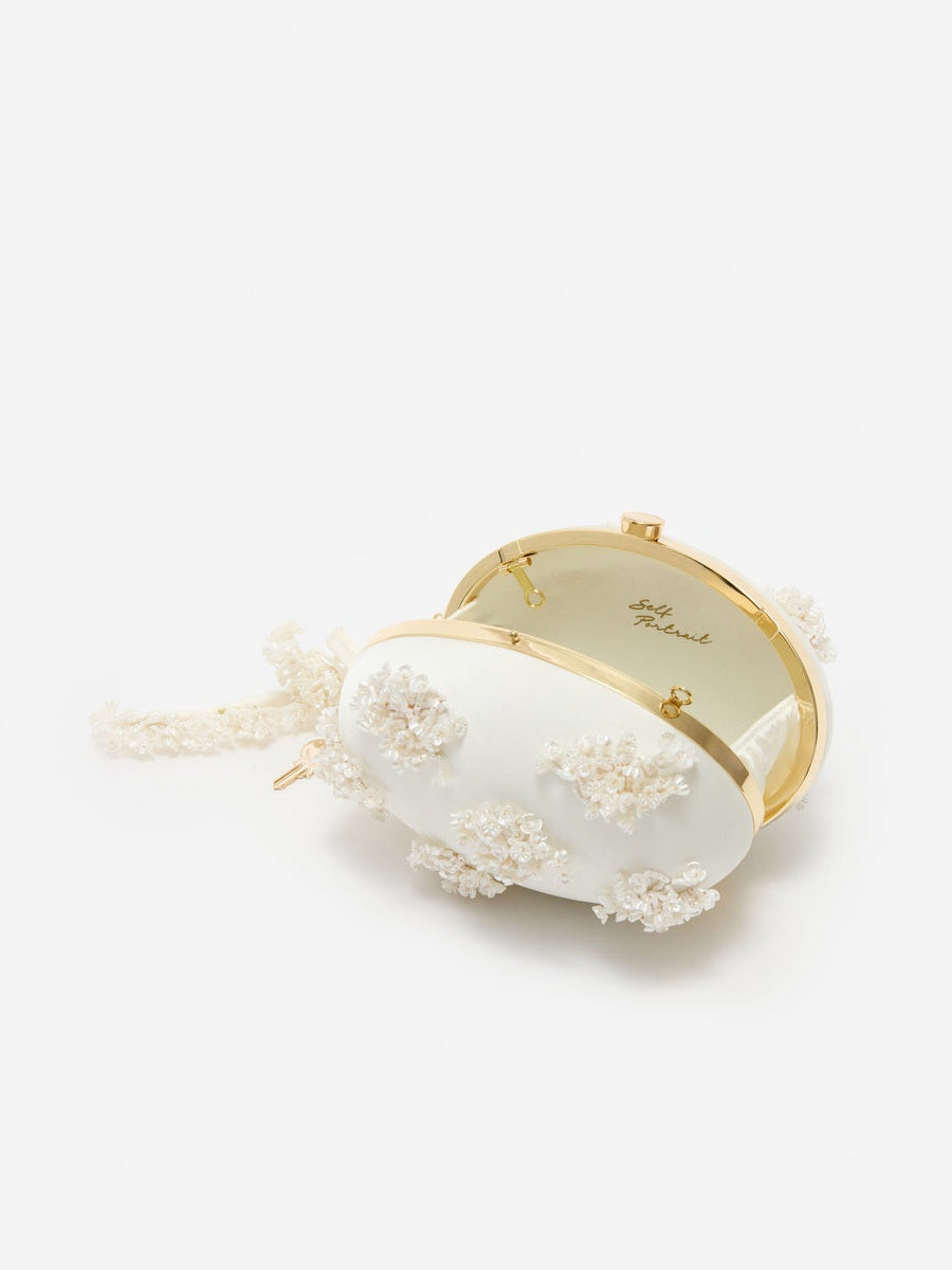 Cream satin floral beaded oval clutch
