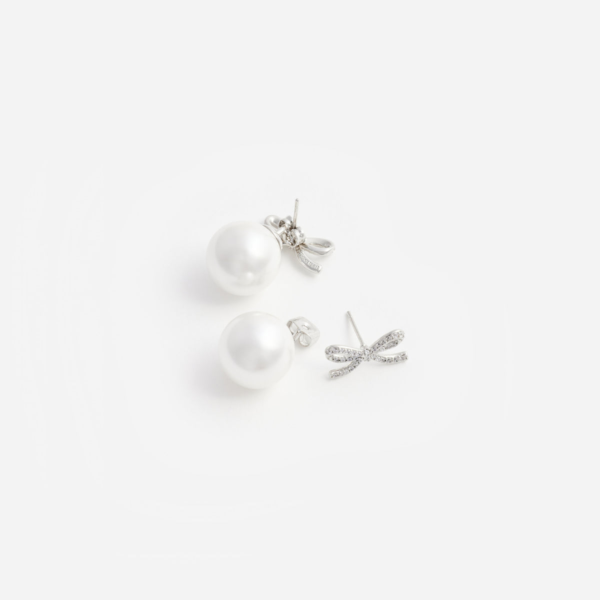Crystal bow pearl back earrings