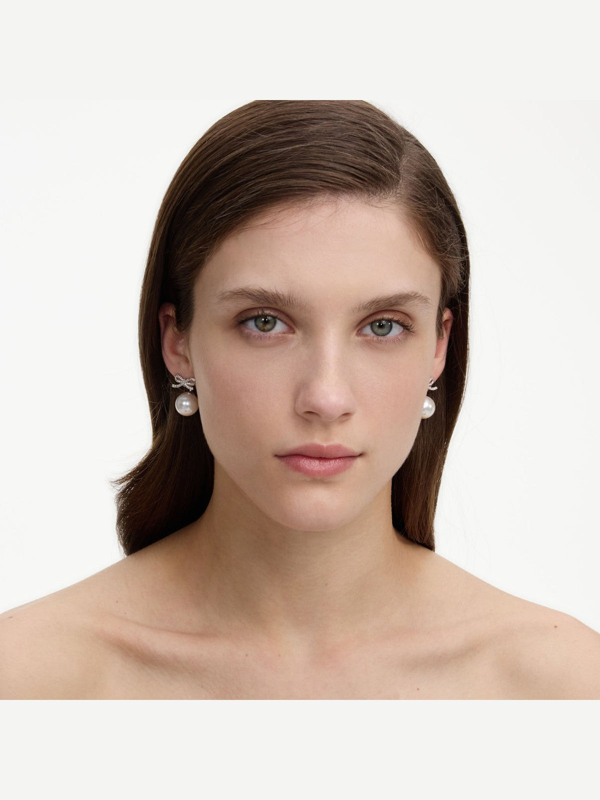 Crystal bow pearl back earrings