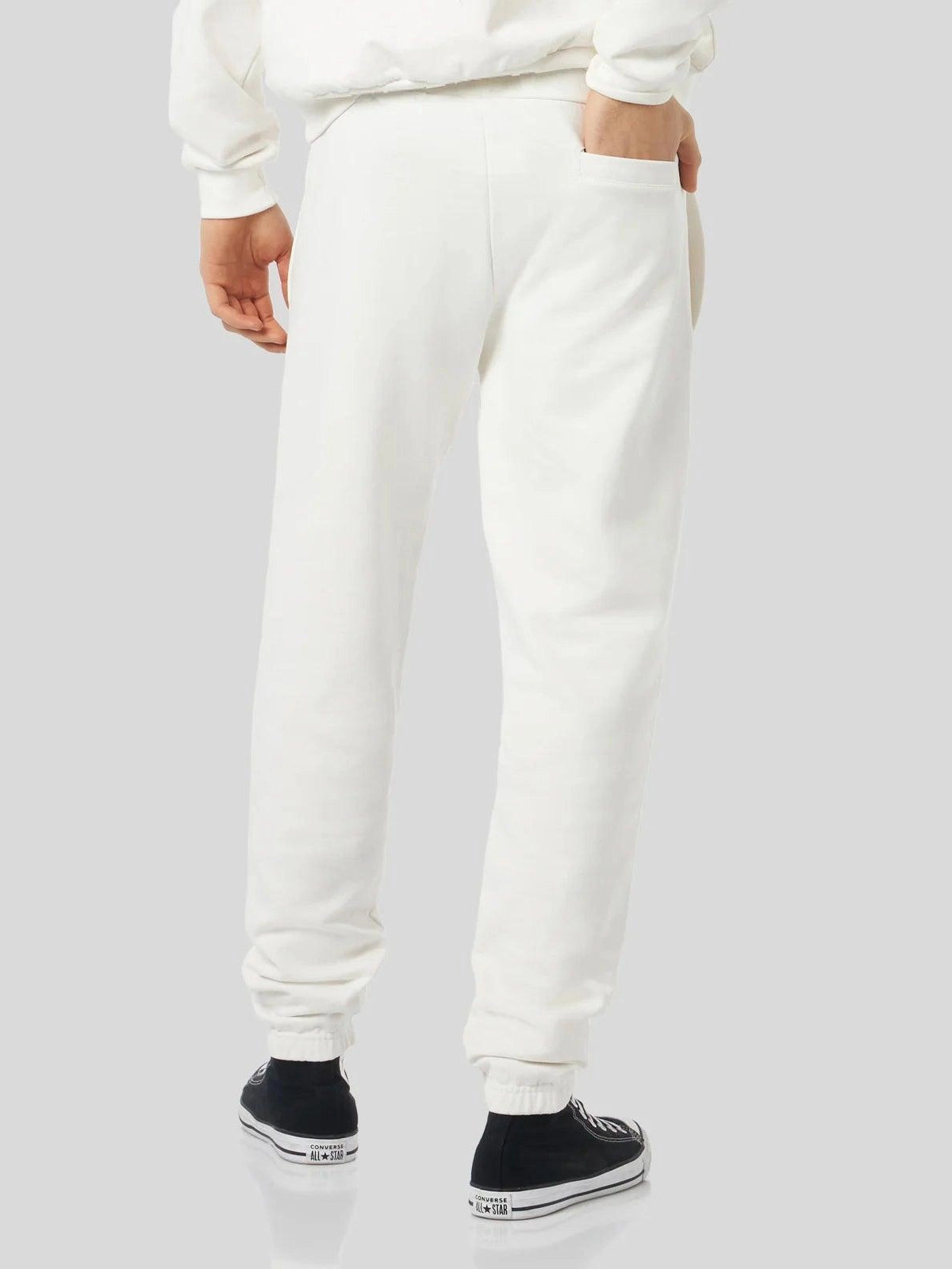 White pants with embroidered logo
