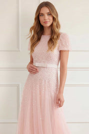 Sequin cascade bow short sleeve gown