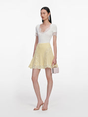 Yellow pointelle knit mini skirt