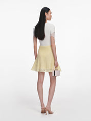 Yellow pointelle knit mini skirt